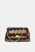 Moda Luxe rectangular woven straw handbag with black and tan zigzag pattern, gold clasp, and detachable chain strap. This boho crossbody bag adds a stylish touch to any outfit.
