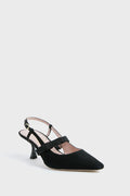 Black suede slingback pump by Kate Spade New York featuring a pointed toe, mid heel, adjustable back strap, and side bow, inspired by the iconic black Maritza pumps for timeless elegance.