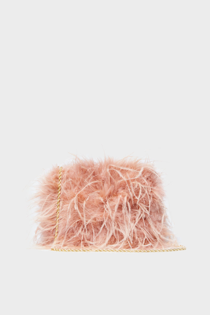 A small pink faux fur crossbody bag with a gold chain strap from Loeffler Randall is featured.