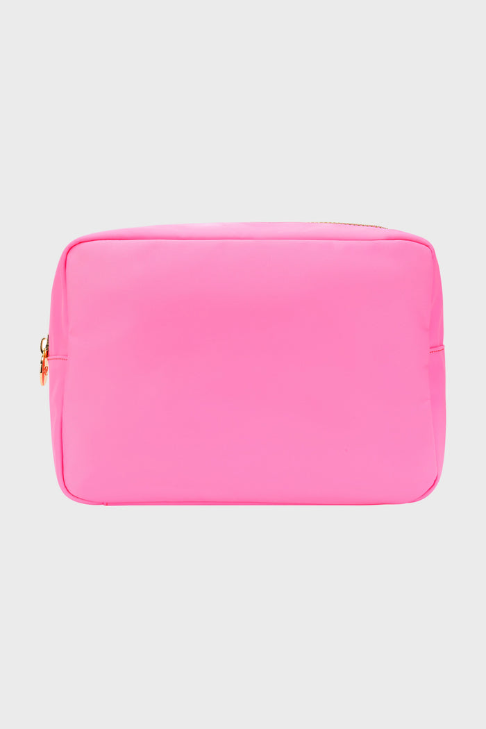 A bright pink rectangular makeup bag by Stoney Clover Lane with gold hardware and a zipper is shown, ideal for travel accessories or use as a small pouch.