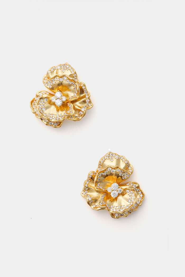 Nicola Bathie gold pansy earrings feature textured petals and clear gemstones, making them a stunning piece of feminine jewelry.