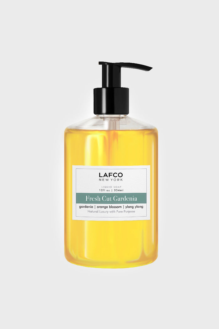 A clear pump bottle of LAFCO New York Fresh Cut Gardenia sulfate-free liquid soap with a yellow tint, featuring scent notes of gardenia, orange blossom, and ylang ylang.