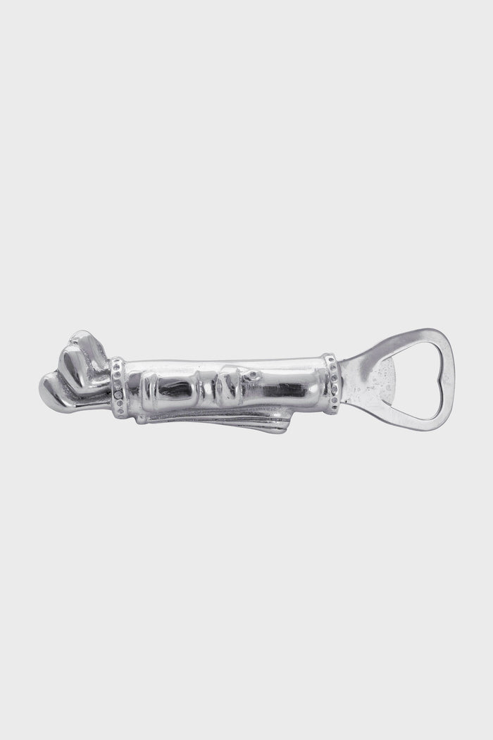 The Mariposa silver metal bottle opener is handcrafted from recycled aluminum and features a decorative handle with a sculpted face and hand design.