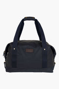 The Barbour black waxed cotton holdall features two sturdy handles and a small front logo patch, making it ideal as an overnight carry bag.
