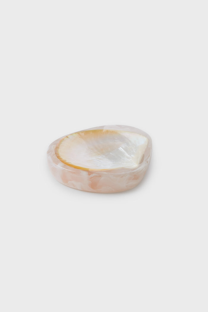 A small, shallow Lily Juliet shell dish with a glossy pale pink and cream finish reminiscent of mother of pearl, perfect for serving caviar.
