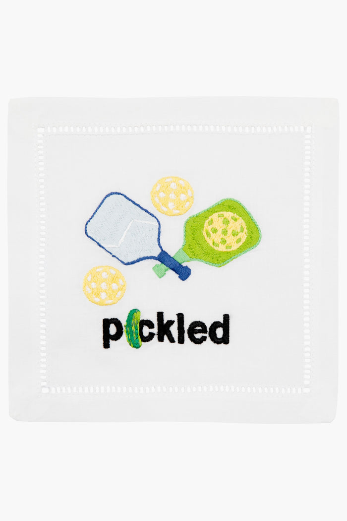 August Morgan white cotton cocktail napkin with embroidered pickleball paddles, balls, and the word "pickled" in black—perfect for your next pickleball-themed gathering.