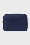 The Stoney Clover Lane rectangular navy blue zippered pouch features gold zipper hardware, ideal for organization or as a large travel accessory.