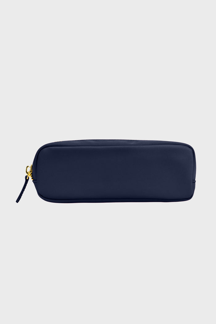 The Stoney Clover Lane rectangular navy blue slim pouch is made of nylon with a gold zipper and pull tab—ideal for organizing travel accessories.