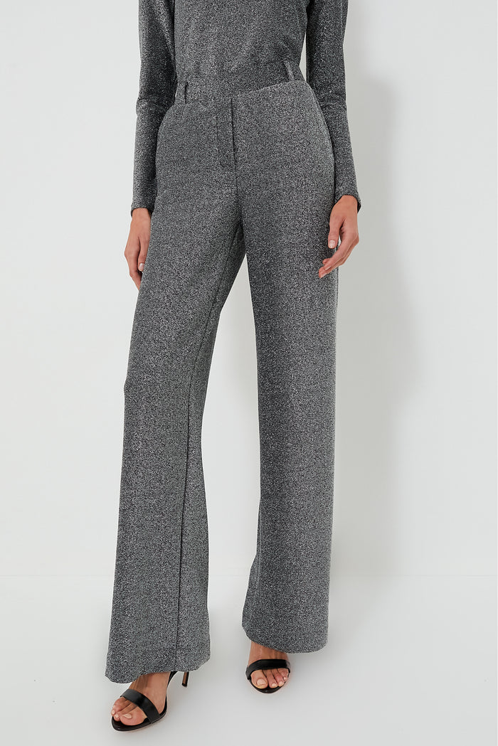 Person wearing high-waisted, wide-leg Jya Pant in Shimmer Gray from Baum Und Pferdgarten with black heeled sandals, standing confidently.