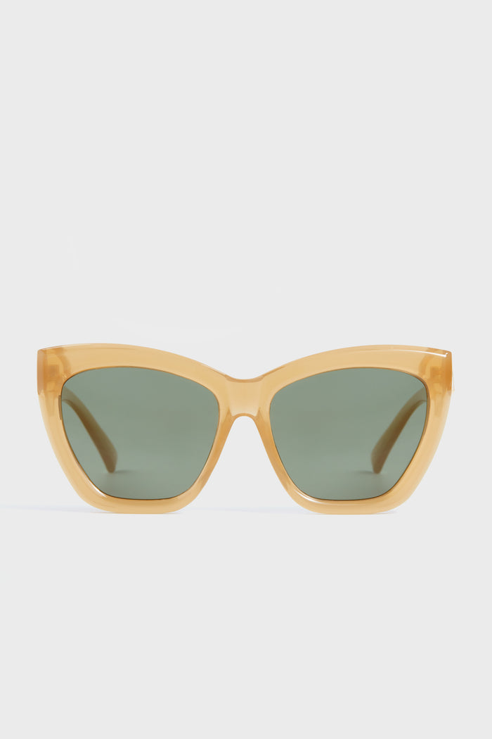 Le Specs thick-framed yellow cat-eye sunglasses with dark green polarized lenses.