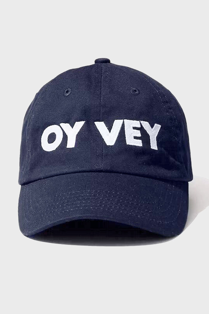 The KULE navy blue OY VEY cap features bold white lettering on the front, making it a perfect match for your favorite stripe tee.