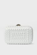 The Olga Berg rectangular white clutch, featuring a textured pattern of raised round beads, is an elegant choice for evening bags and special occasions.